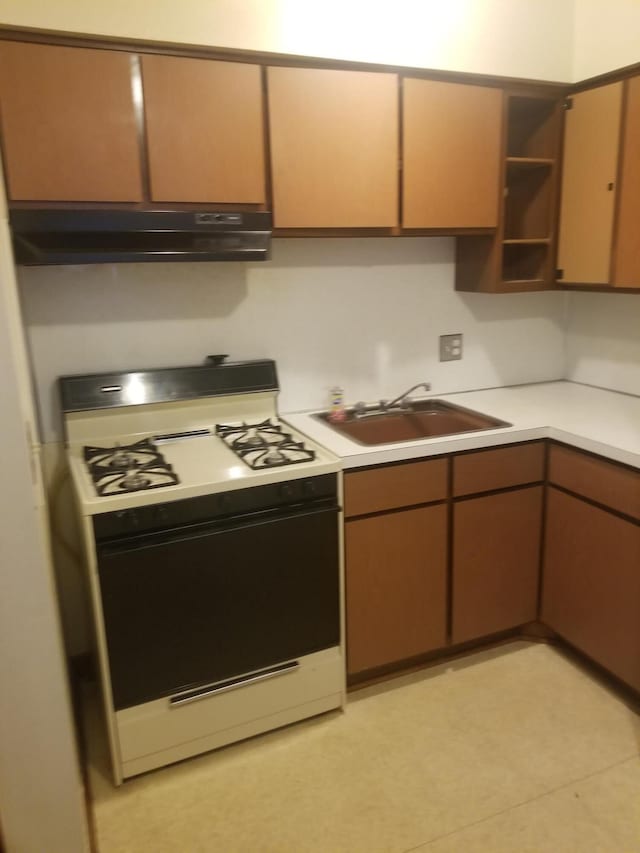 kitchen with gas range and sink