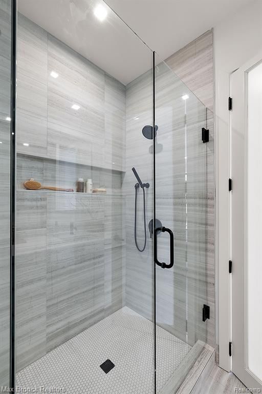 full bathroom with a shower stall