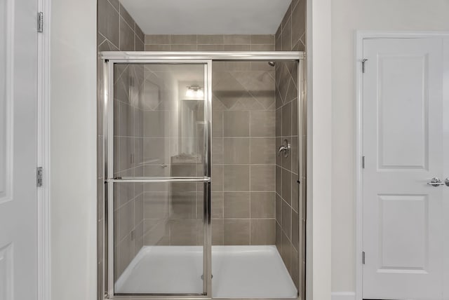 full bathroom featuring a stall shower