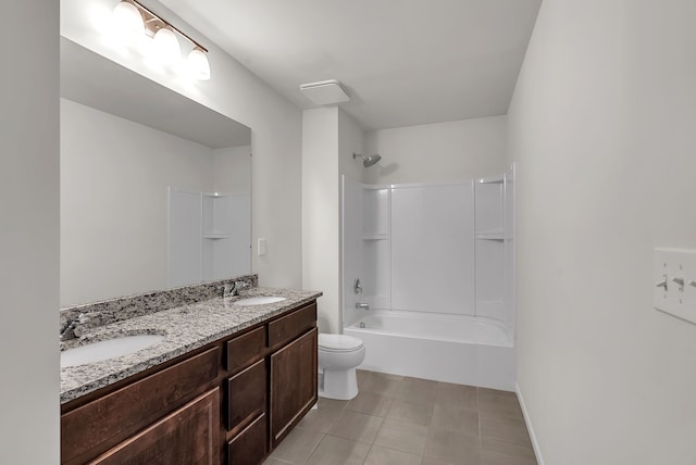 bathroom with double vanity, a sink, toilet, and shower / bathtub combination