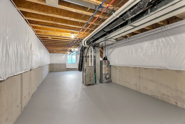 basement with gas water heater and heating unit