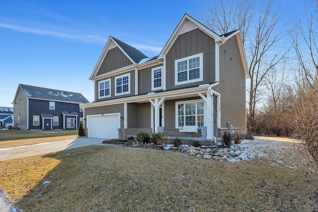 craftsman inspired home with concrete driveway, an attached garage, covered porch, a front lawn, and board and batten siding