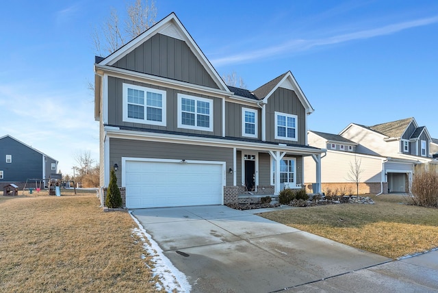 view of front of house with a porch, concrete driveway, an attached garage, board and batten siding, and a front yard