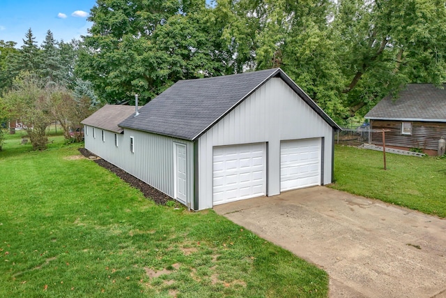 garage featuring a lawn