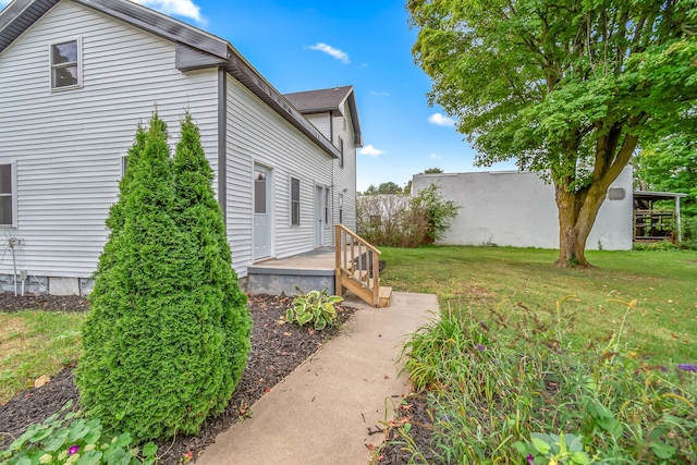 view of property exterior with a yard