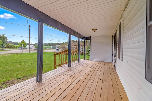 wooden deck with a yard
