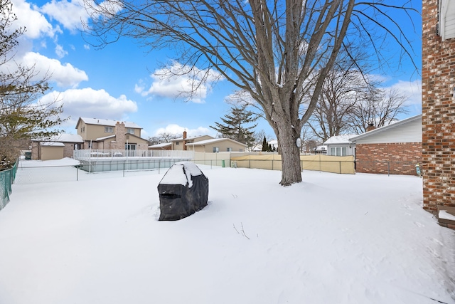 view of yard covered in snow