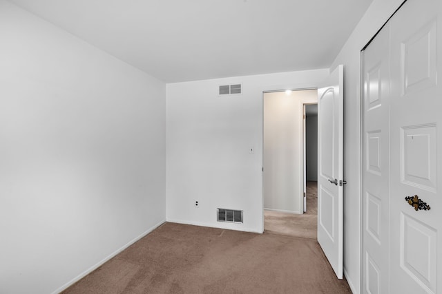 unfurnished bedroom featuring carpet flooring