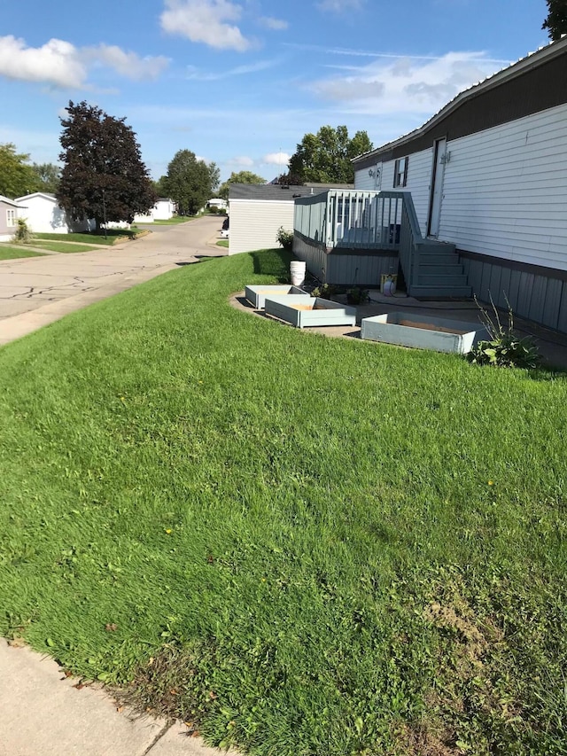 view of yard with a wooden deck