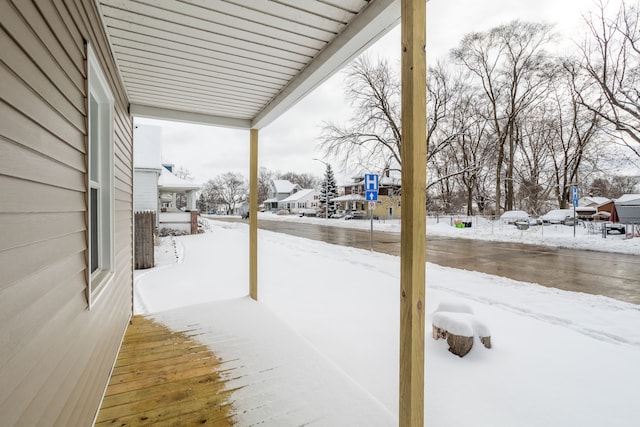 view of yard layered in snow