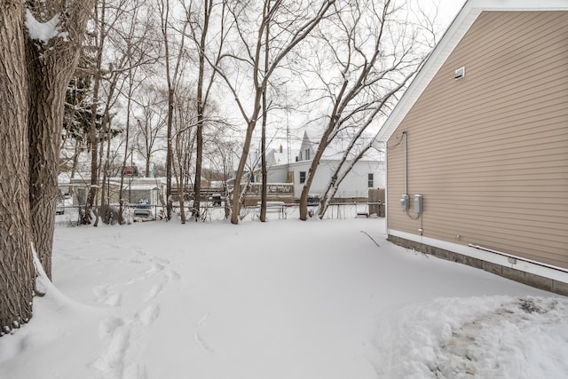 view of yard covered in snow