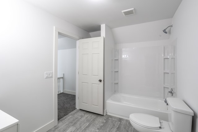 bathroom featuring shower / bathtub combination and toilet