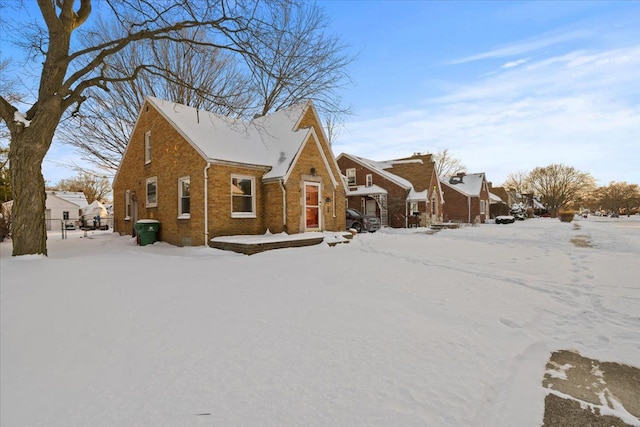 view of front of house featuring a residential view and brick siding