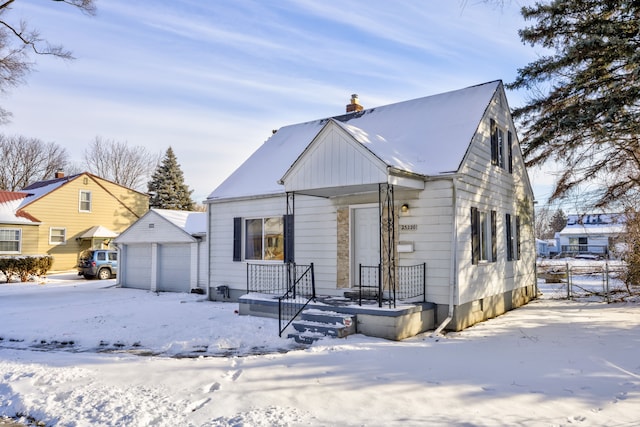 view of front of house with an outdoor structure and a garage