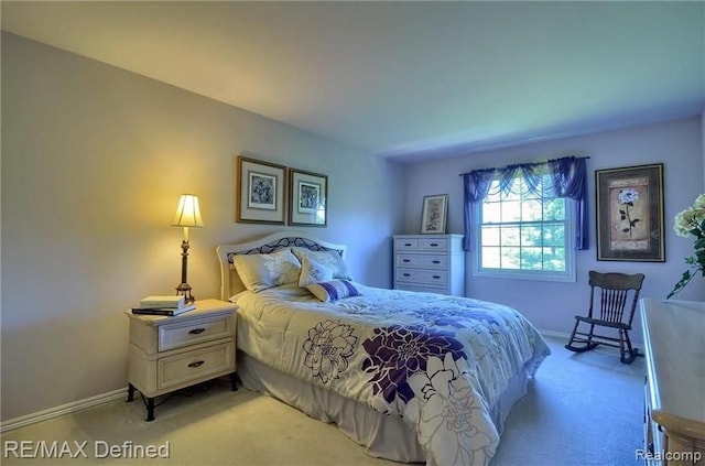 bedroom featuring light colored carpet