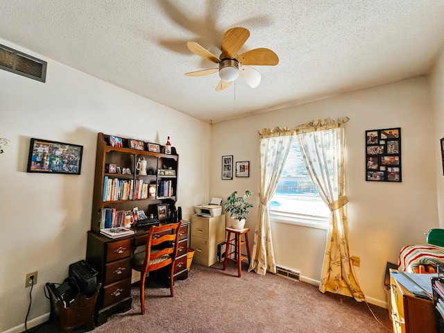 carpeted home office featuring ceiling fan and a textured ceiling