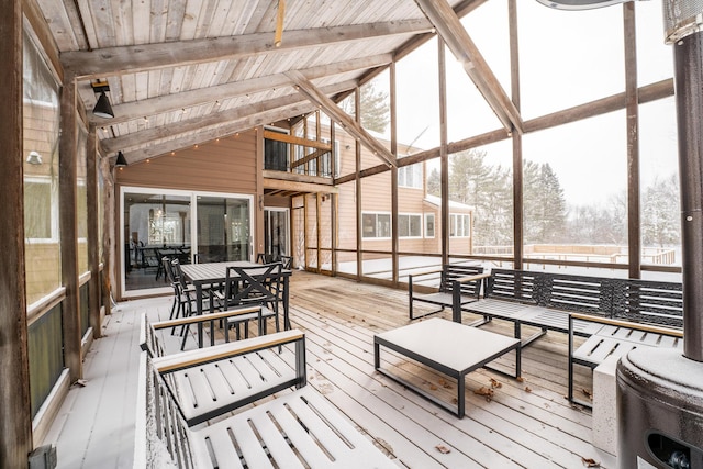 sunroom / solarium featuring wooden ceiling and vaulted ceiling with beams