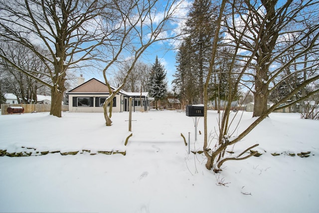 view of yard covered in snow