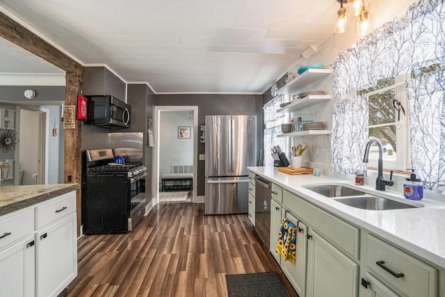 kitchen featuring dark wood-type flooring, sink, green cabinetry, stainless steel appliances, and white cabinets