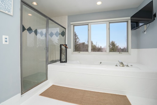 full bath featuring recessed lighting, a garden tub, a shower stall, and tile patterned floors