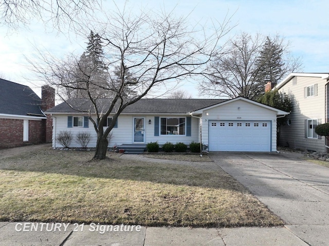 ranch-style house with driveway, a front yard, and a garage