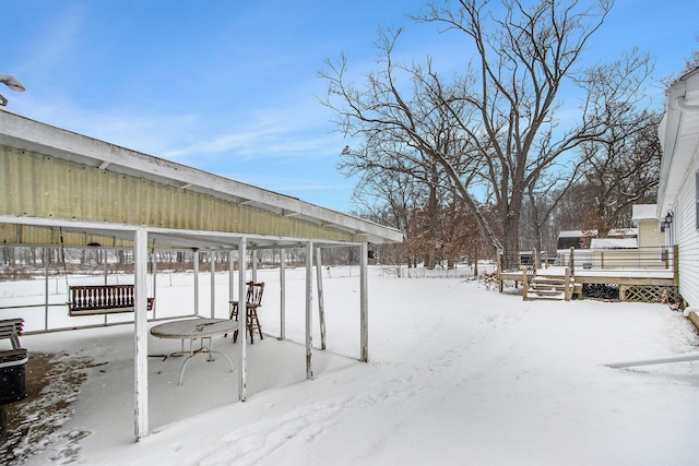 view of yard layered in snow