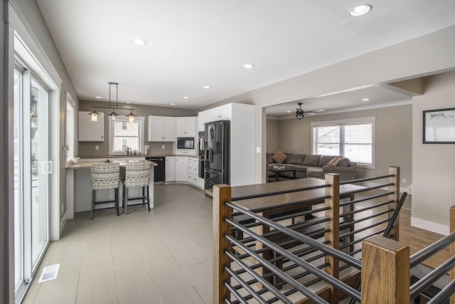 dining room with a wealth of natural light and ceiling fan