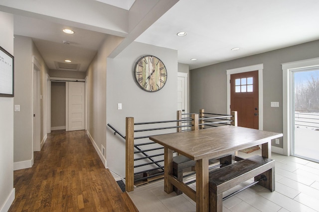 dining space with dark hardwood / wood-style flooring