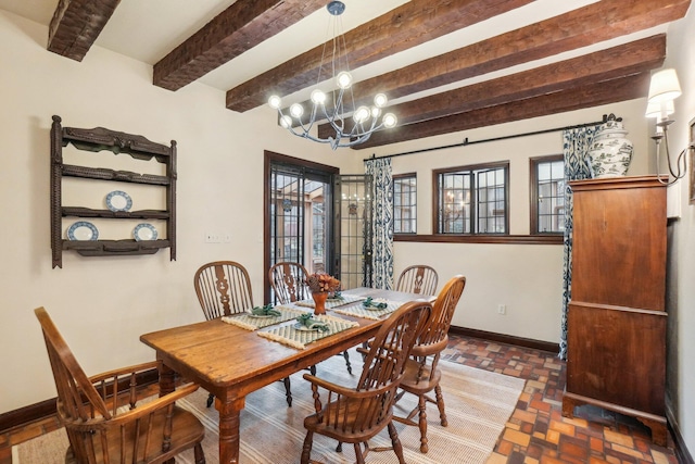 dining room featuring an inviting chandelier and beamed ceiling