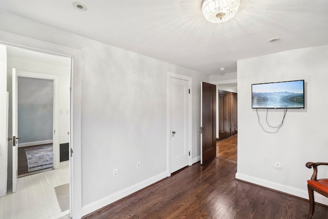 unfurnished bedroom with wood-type flooring