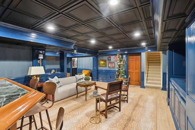 game room featuring ornamental molding and light hardwood / wood-style floors