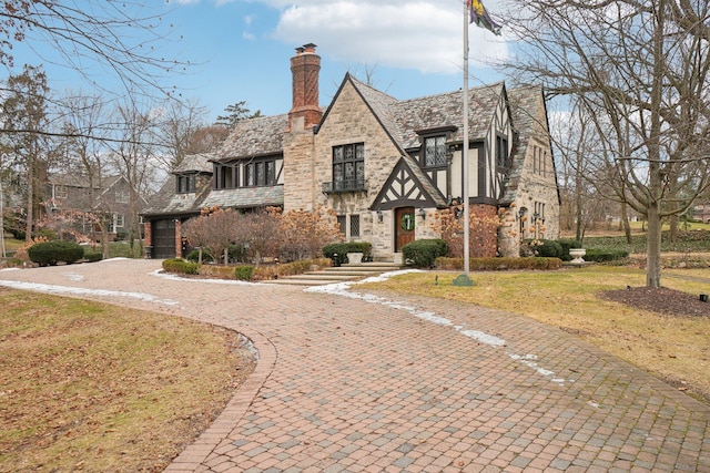 tudor house with a front lawn