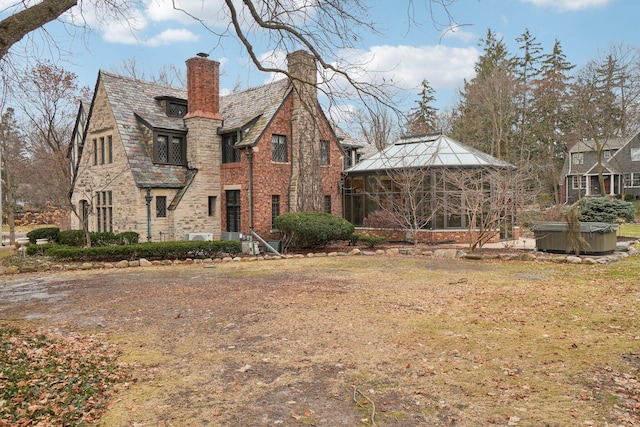 exterior space featuring a gazebo and a hot tub