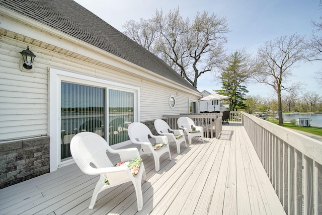 wooden deck with a water view