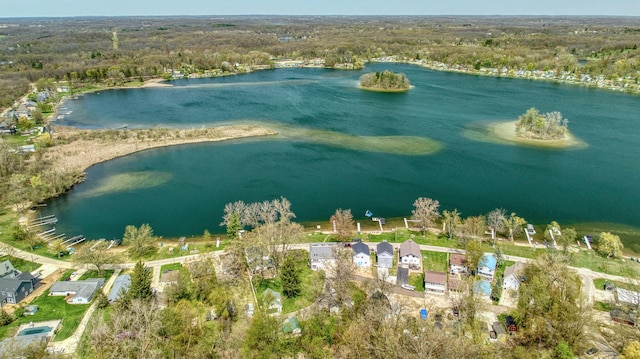 aerial view featuring a water view and a forest view