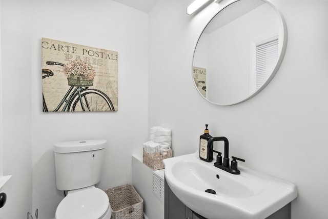 bathroom with toilet and vanity