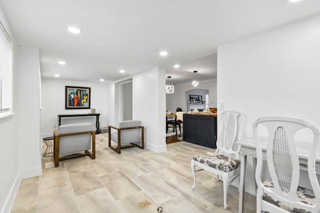 interior space with baseboards and recessed lighting