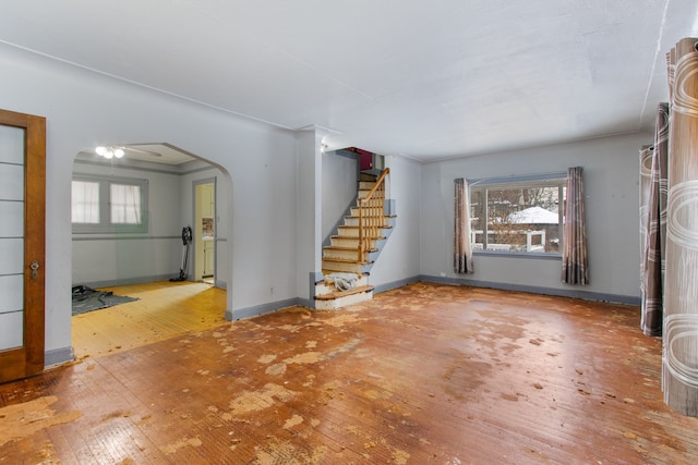 unfurnished living room featuring hardwood / wood-style floors and a healthy amount of sunlight