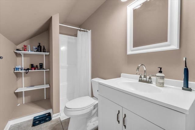 bathroom featuring lofted ceiling, vanity, toilet, and tile patterned flooring