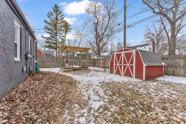 snowy yard with a storage unit