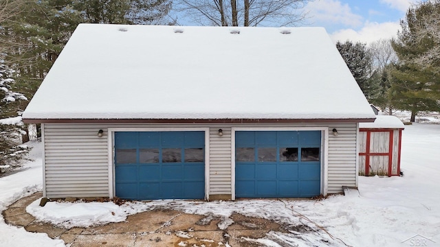 view of snow covered garage