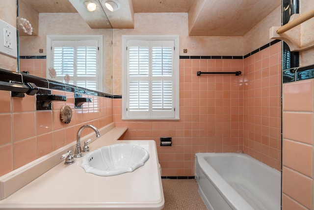 bathroom featuring tile patterned floors, sink, and tile walls