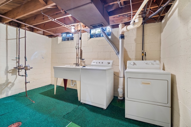 laundry area with independent washer and dryer