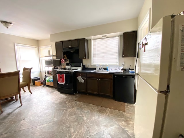 kitchen with white fridge, black dishwasher, range with gas cooktop, and dark brown cabinets