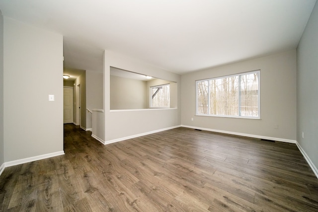 spare room with dark hardwood / wood-style flooring