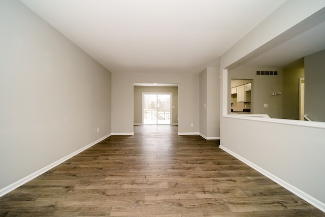 empty room featuring wood-type flooring