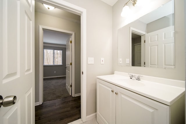 bathroom with vanity and hardwood / wood-style floors