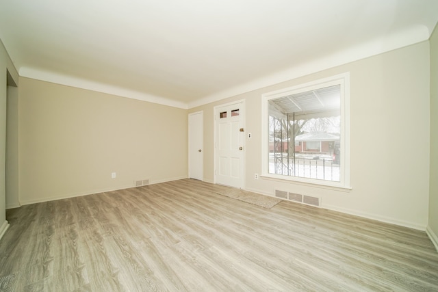 unfurnished living room with light hardwood / wood-style floors