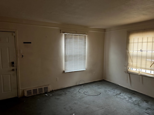 unfurnished room with carpet flooring