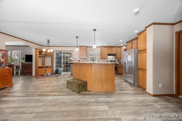 kitchen with hanging light fixtures, ornamental molding, a center island, light stone counters, and stainless steel appliances